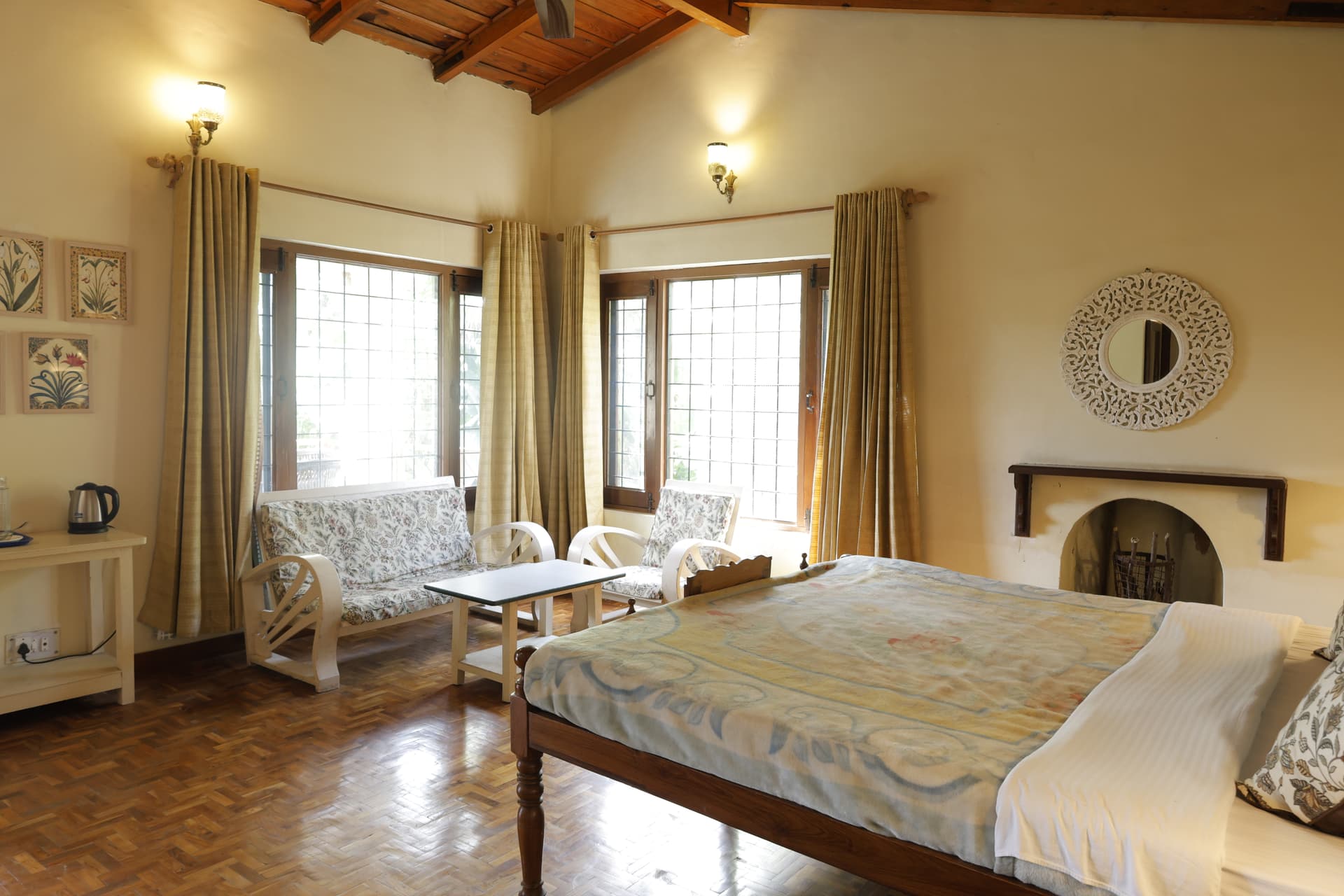 First guest room at Green Glen — warm wooden floors and earthy furnishings